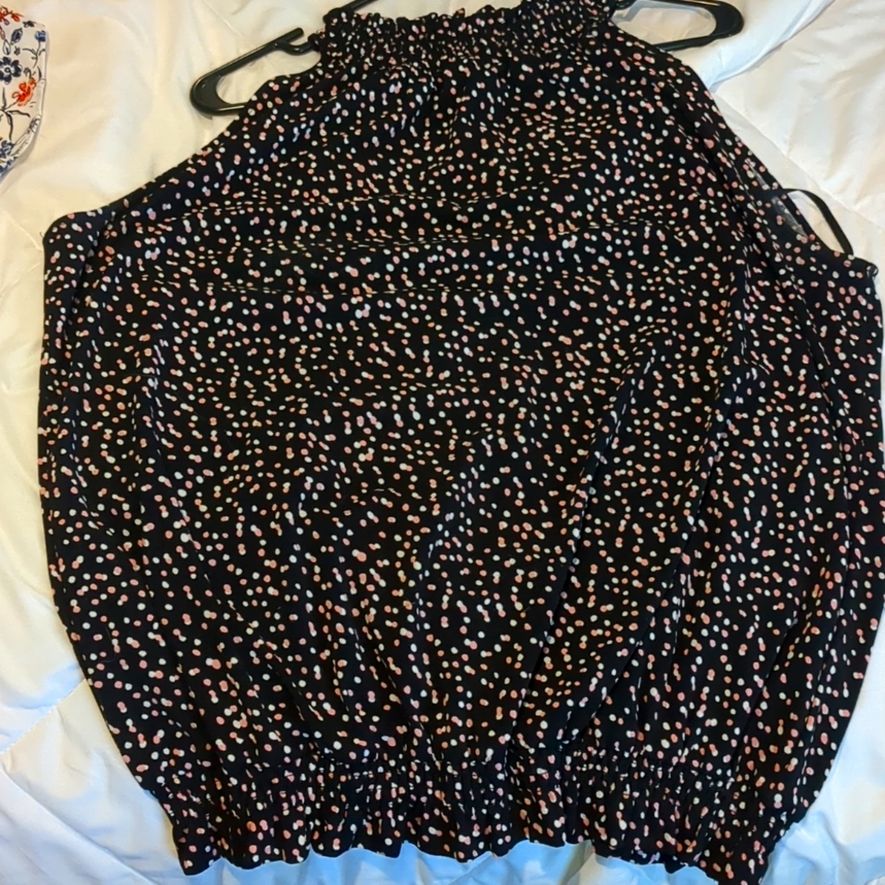 Black Sleeveless elastic waist blouse.